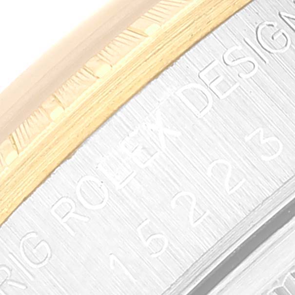 The image shows a close-up of the "ROLEX DESIGN" engraving on the case side of a Rolex Date 15223 Men's Steel and Gold (two tone) Champagne Dial 15223 Men's Steel and Gold (two tone) Champagne Dial model watch.