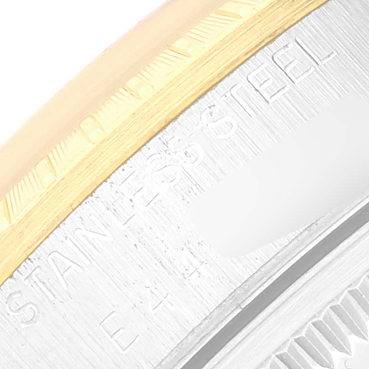 This is a close-up of the inner bezel and part of the engravings on the Rolex Date 15223 Men's Steel and Gold (two tone) Champagne Dial 15223 Men's Steel and Gold (two tone) Champagne Dial model watch.