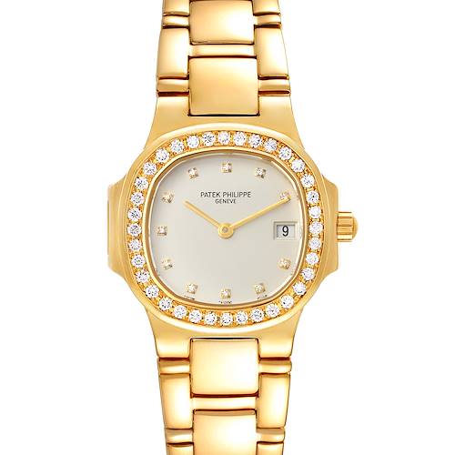The image shows a front view of a Patek Philippe Nautilus 4700/530 Women's Yellow Gold Beige Dial 4700/530 Women's Yellow Gold Beige Dial watch with a gold bracelet and diamond bezel.