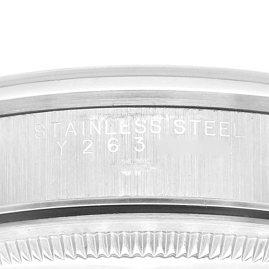 This image shows a close-up view of the stainless steel case back with engravings and the fluted bezel of a Rolex Date 15200 Men's Stainless Steel Black Dial 15200 Men's Stainless Steel Black Dial watch.