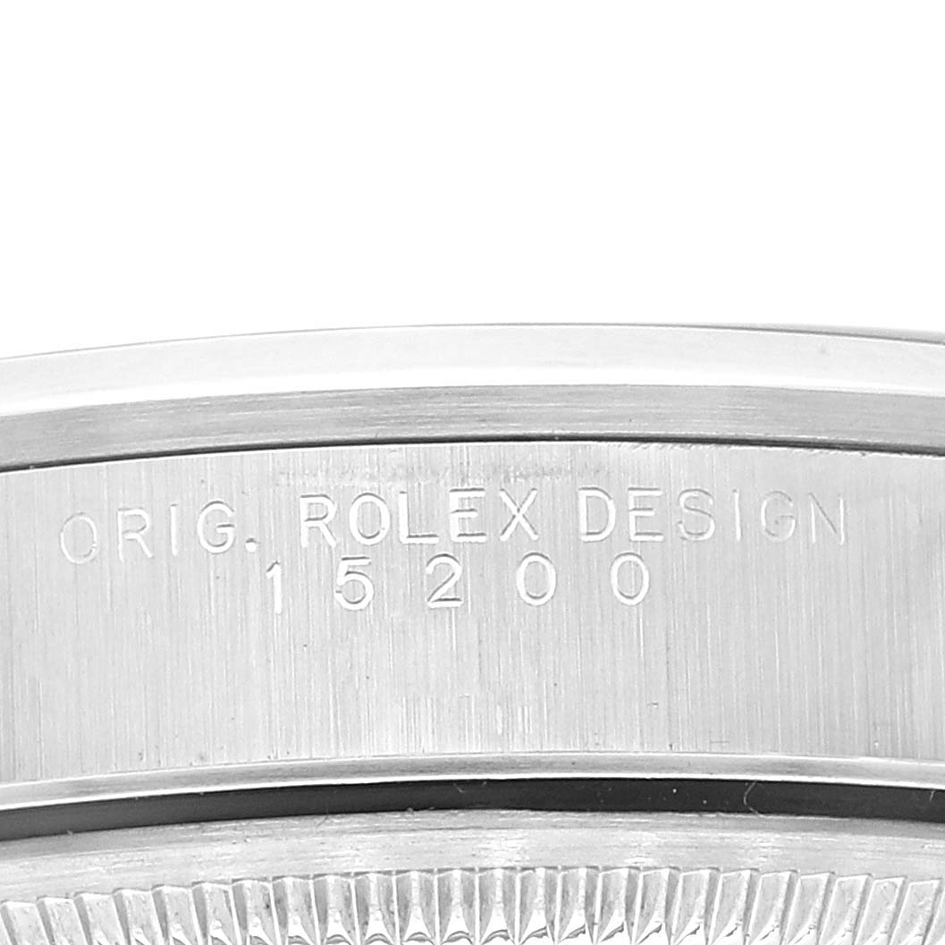 The image shows a close-up view of the engraved details and bezel of a Rolex Date 15200 Men's Stainless Steel Black Dial 15200 Men's Stainless Steel Black Dial model, displaying the design code 15200.