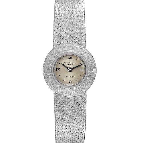 This image shows a Calatrava watch by Patek Philippe from a front angle, highlighting its dial and woven metal strap.