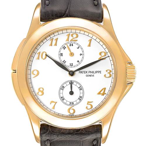 This is a close-up front view of a Patek Philippe Calatrava 5134J Men's Yellow Gold White Dial 5134J Men's Yellow Gold White Dial watch, showing the dial, hands, and part of the strap.