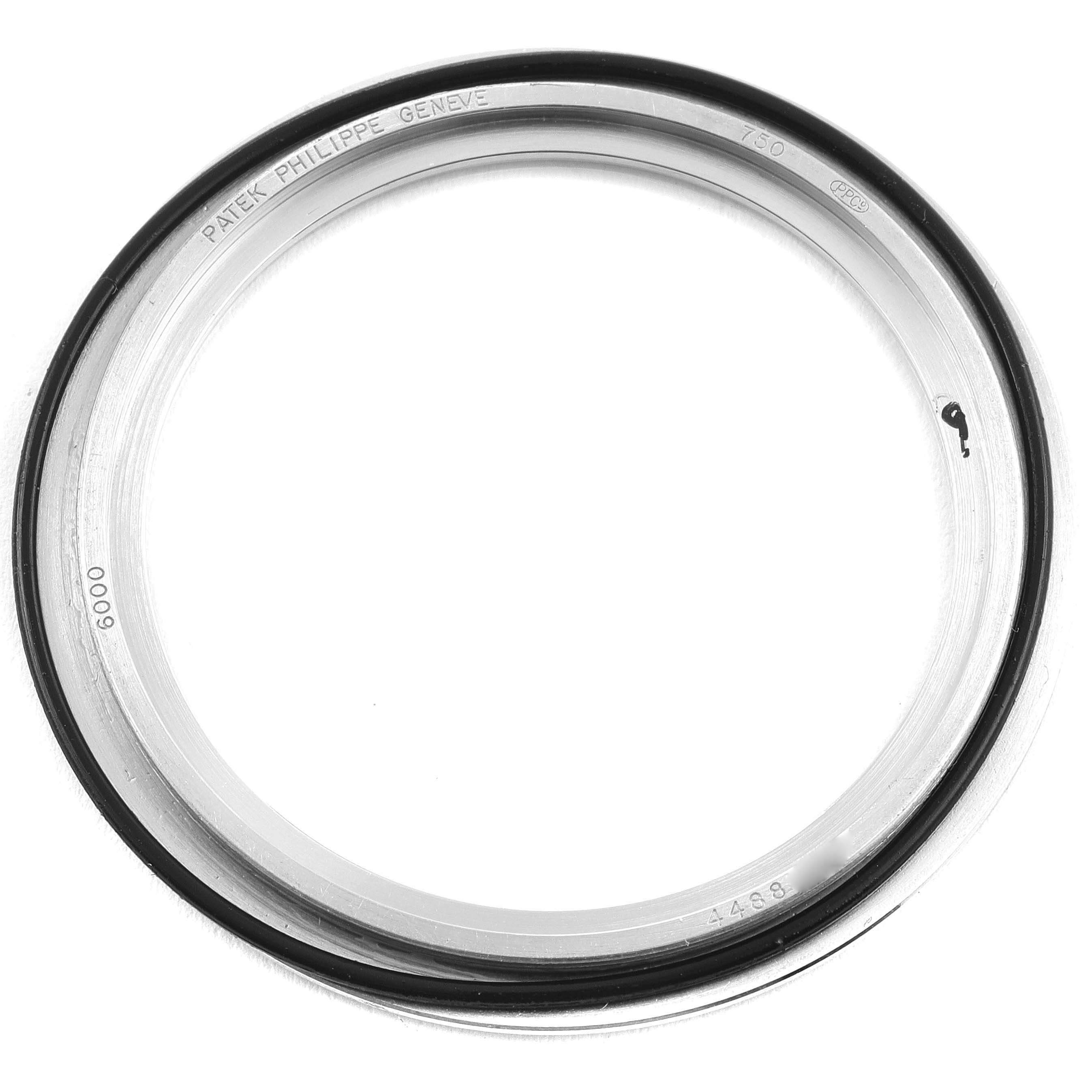 The image shows a close-up of the bezel for a Patek Philippe Calatrava 6000G Men's White Gold Grey Dial 6000G Men's White Gold Grey Dial watch.