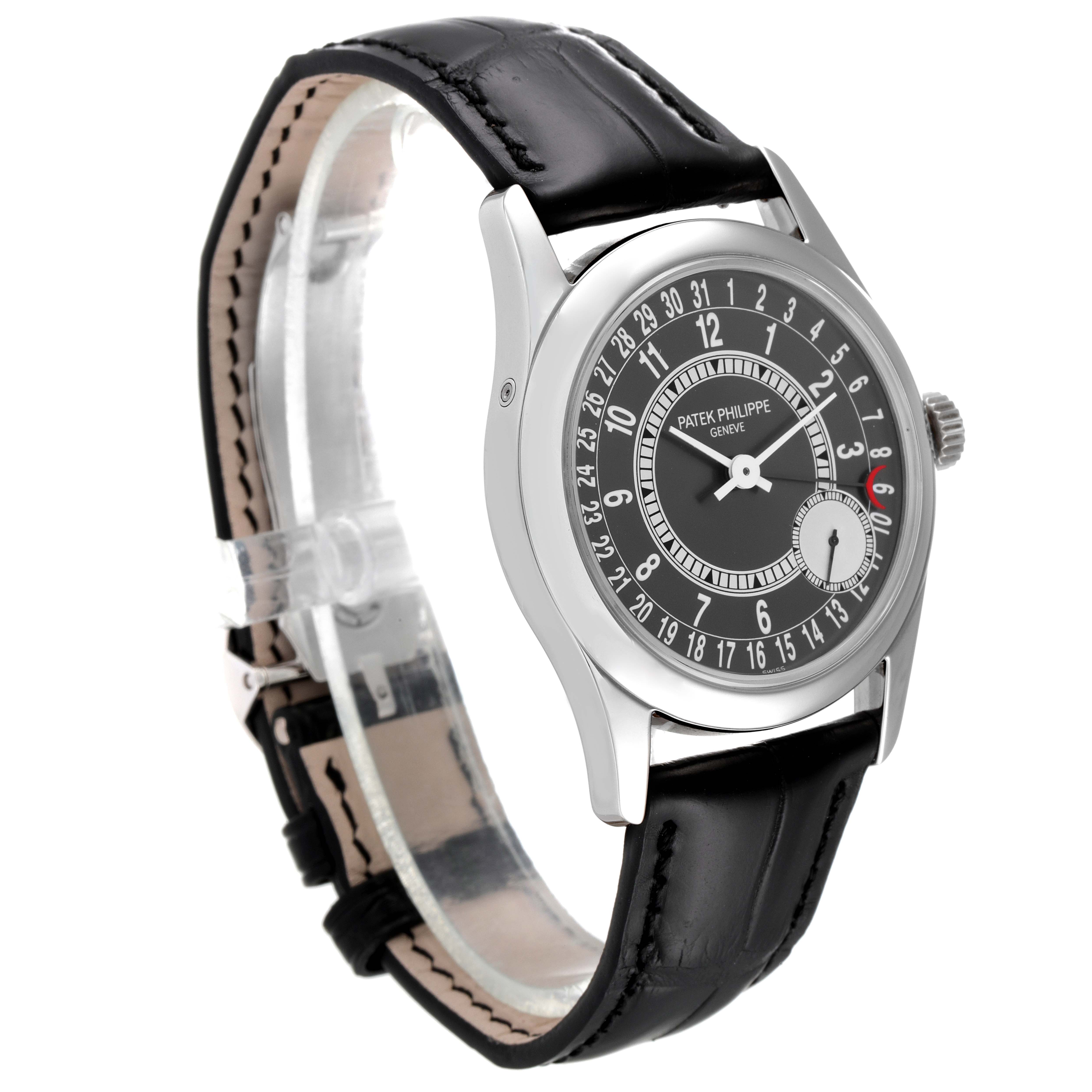 This image shows a front and side angle of a Patek Philippe Calatrava 6000G Men's White Gold Grey Dial 6000G Men's White Gold Grey Dial watch with a black leather strap.