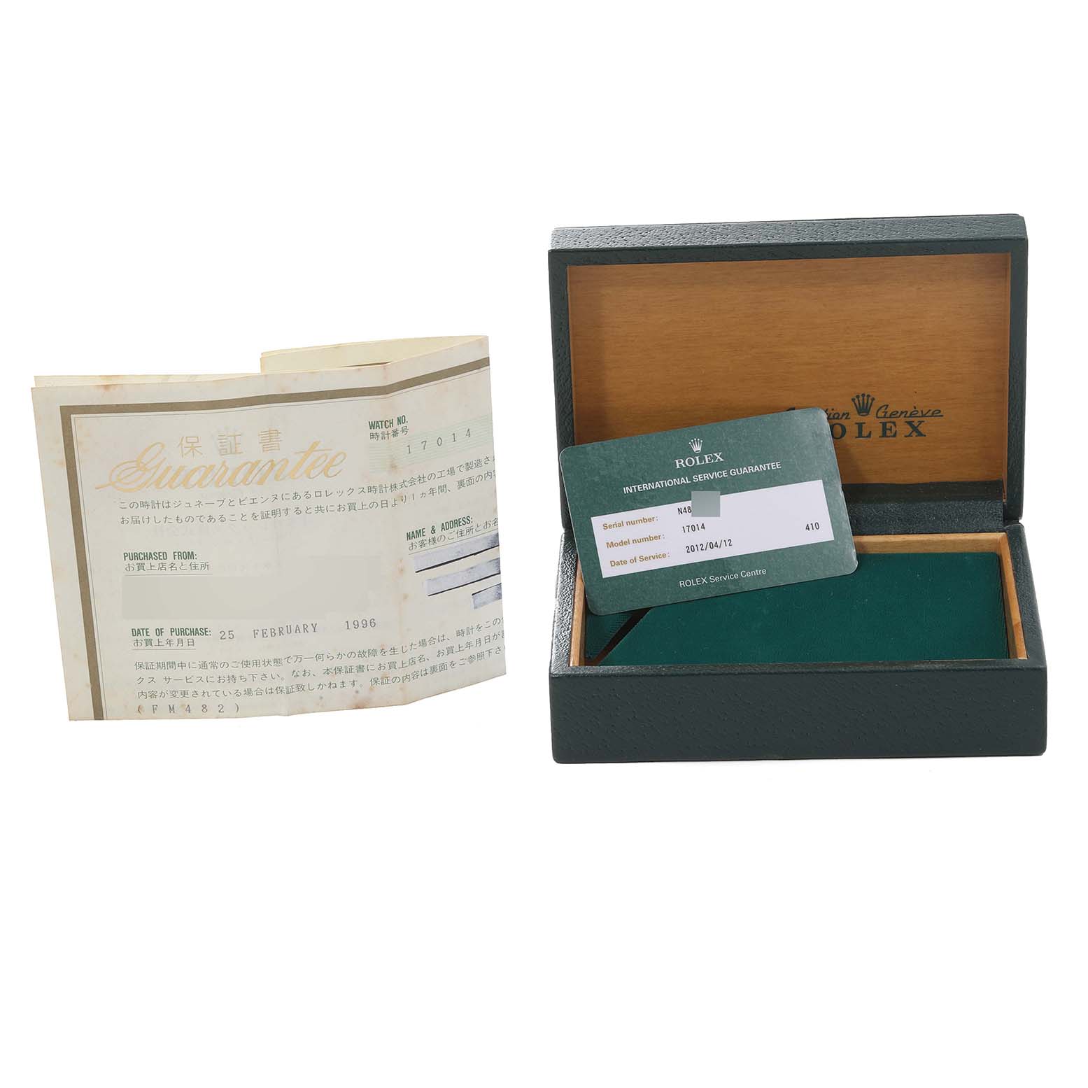 The image shows an empty Rolex Oysterquartz 17014 Men's Stainless Steel Silver Dial 17014 Men's Stainless Steel Silver Dial watch box and accompanying paperwork, including an international service guarantee card.