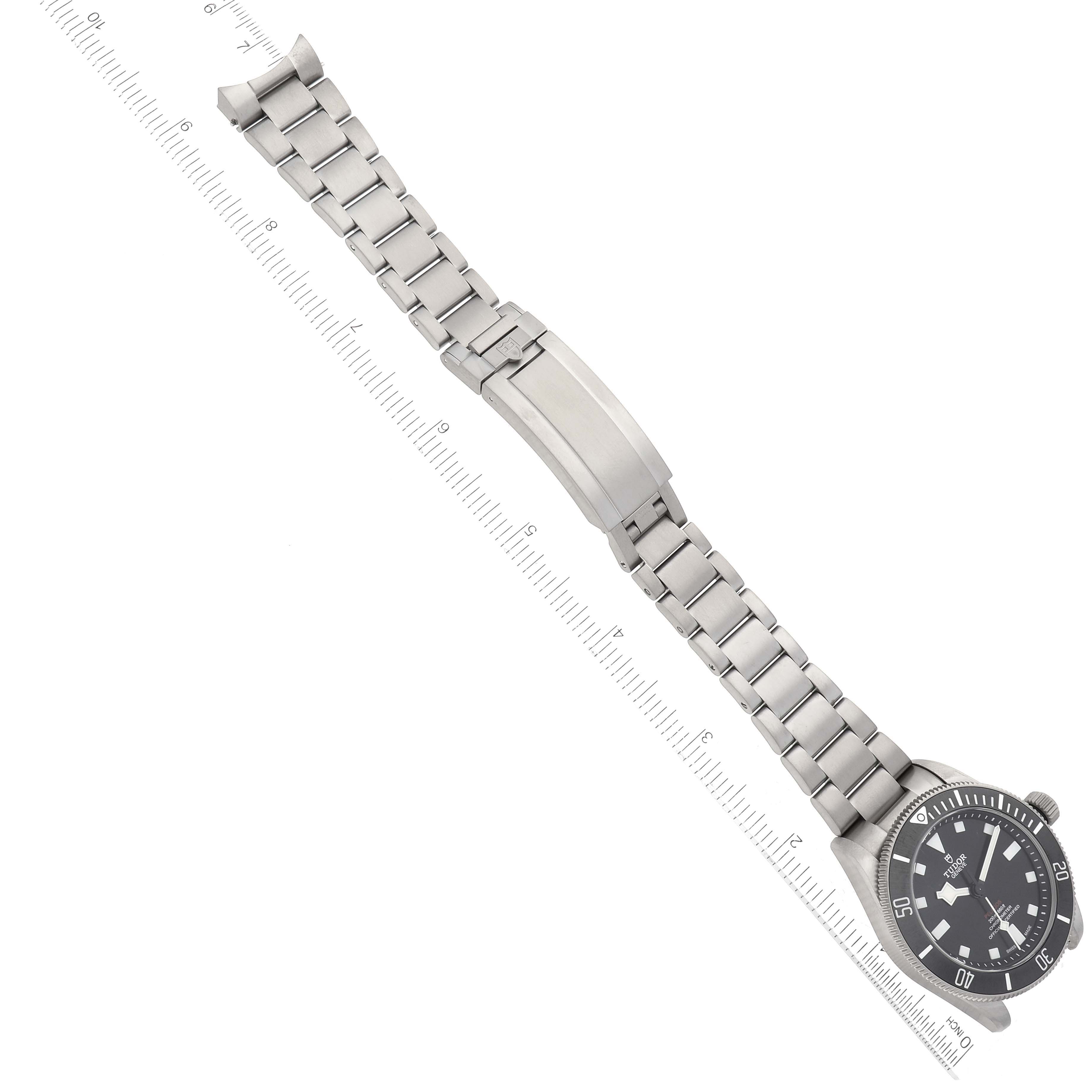 The image shows the Tudor Pelagos 25407N Men's Titanium Black Dial 25407N Men's Titanium Black Dial watch from an aerial view, highlighting its stainless steel bracelet and clasp.