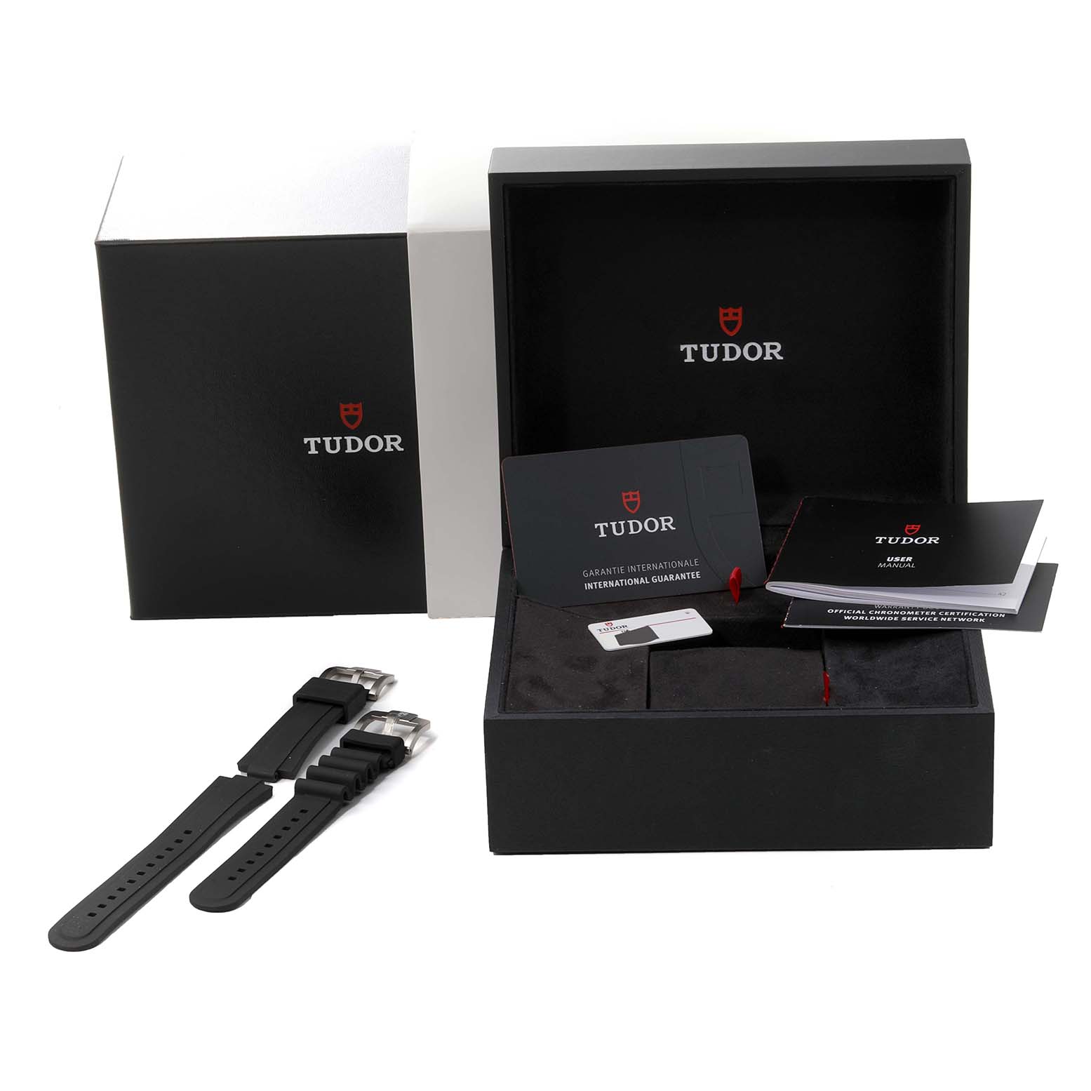 The image shows a Tudor Pelagos 25407N Men's Titanium Black Dial 25407N Men's Titanium Black Dial watch box, warranty cards, manuals, and two black rubber straps.