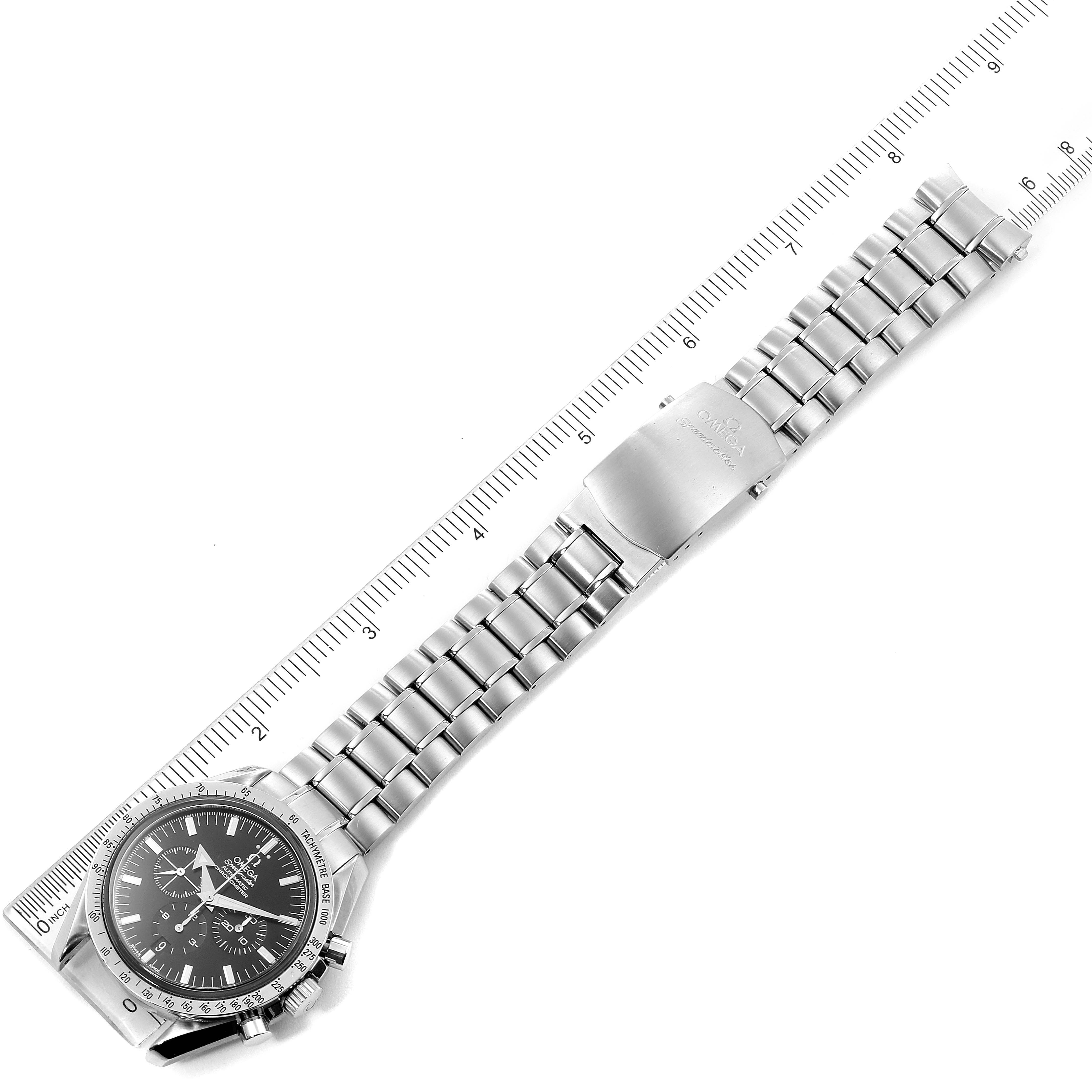 The image shows an overhead view of an Omega Speedmaster 3551.50.00 Men's Stainless Steel Black Dial 3551.50.00 Men's Stainless Steel Black Dial watch, displaying its face and metal bracelet alongside a ruler for scale.