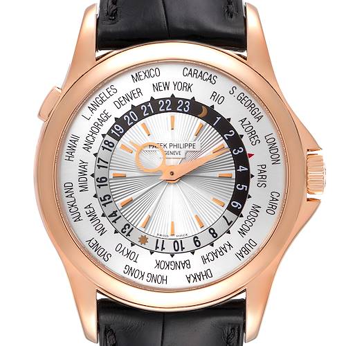 The image shows a frontal view of the Patek Philippe Complications 5130R Men's Rose Gold Silver Dial 5130R Men's Rose Gold Silver Dial watch, displaying the dial, hands, world time cities, and black leather strap.