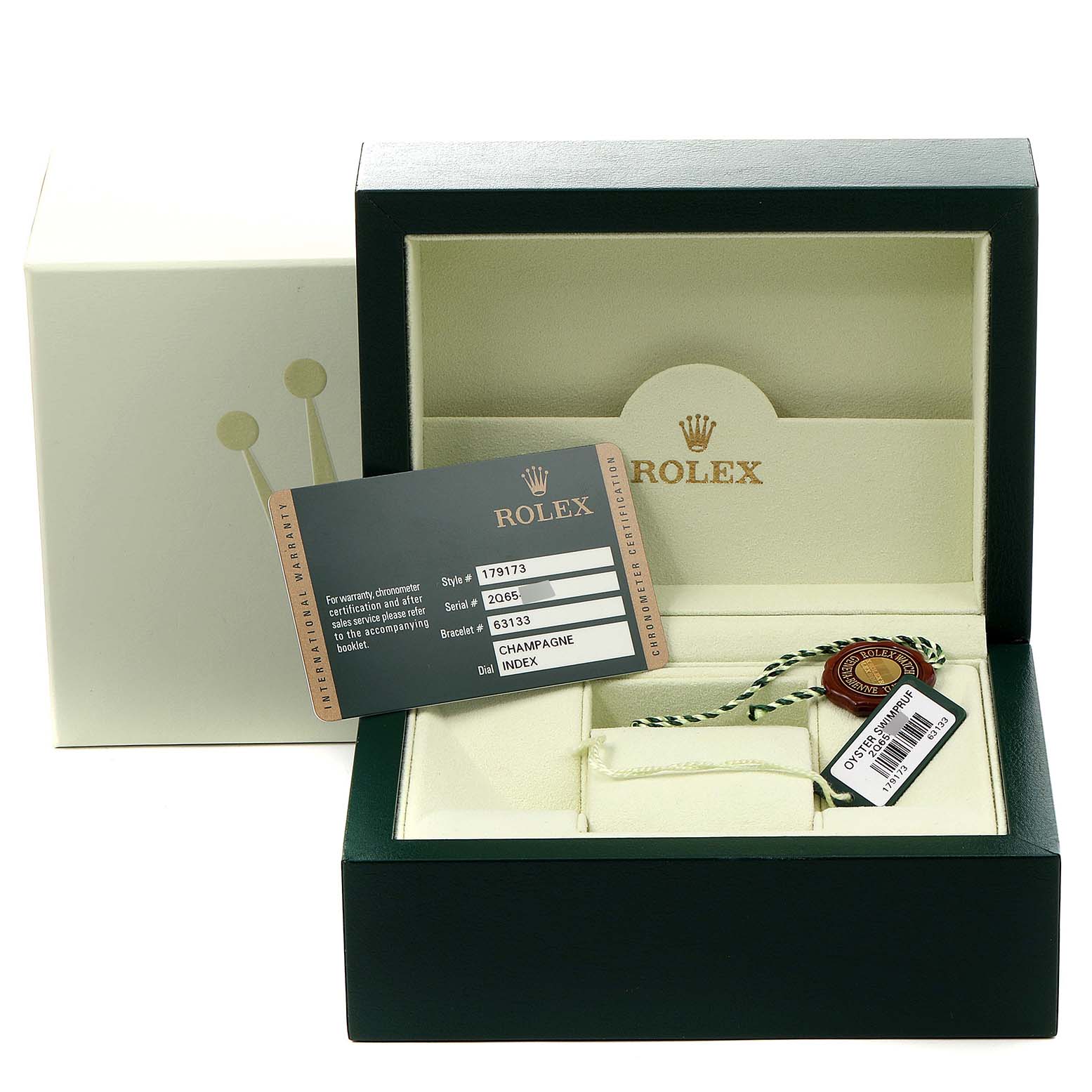 The image shows a Rolex Datejust 179173 Women's Steel and Gold (two tone) Champagne Dial 179173 Women's Steel and Gold (two tone) Champagne Dial watch box, warranty card, and a tag, viewed from the front.