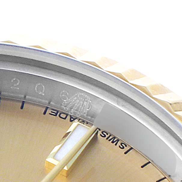 This is a close-up angle showing the dial and rehaut of the Rolex Datejust 179173 Women's Steel and Gold (two tone) Champagne Dial 179173 Women's Steel and Gold (two tone) Champagne Dial watch.