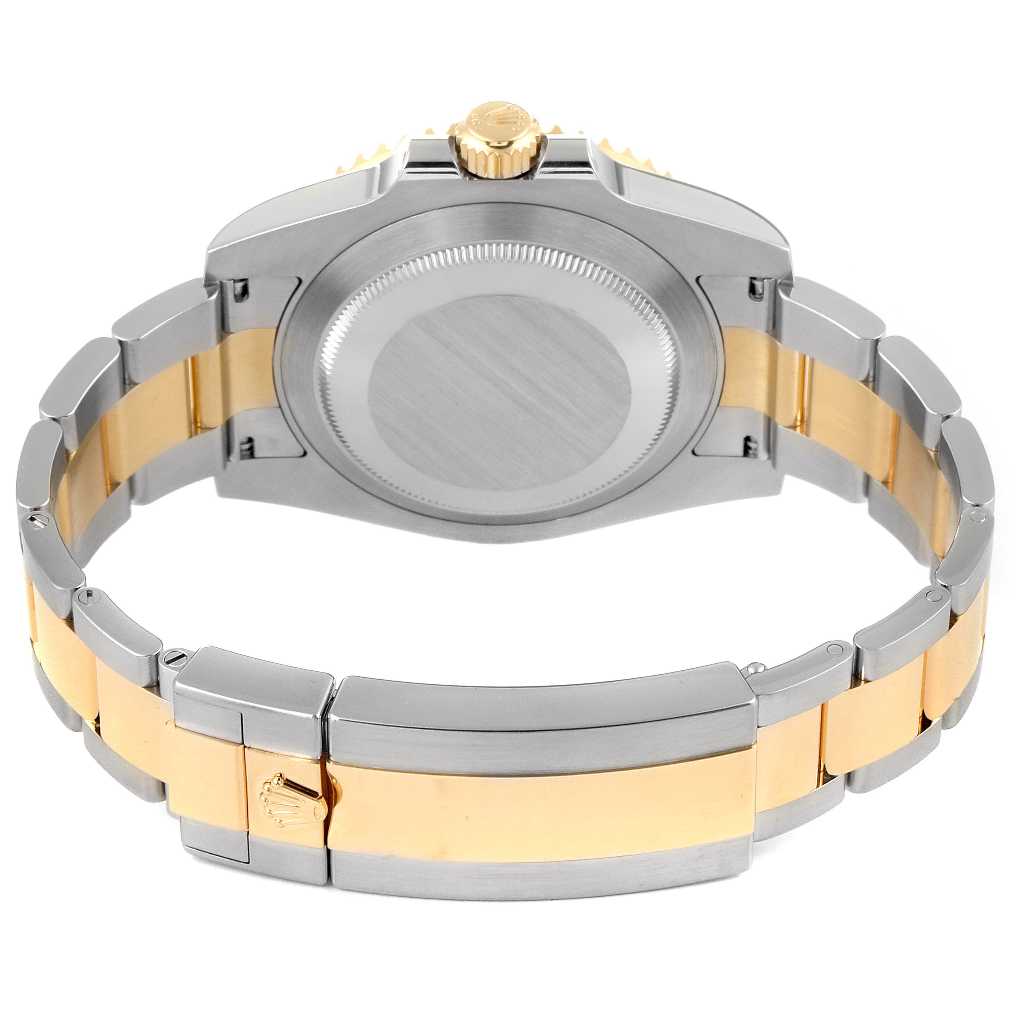 This image shows the back case and bracelet of a Rolex Submariner 116613 Men's Steel and Gold (two tone) Black Dial 116613 Men's Steel and Gold (two tone) Black Dial watch, highlighting its two-tone metal design.
