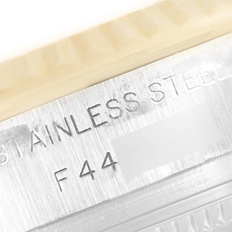 The image shows a close-up angle of the stainless steel case back of a Rolex Datejust 179173 Women's Steel and Gold (two tone) Silver Dial 179173 Women's Steel and Gold (two tone) Silver Dial watch.