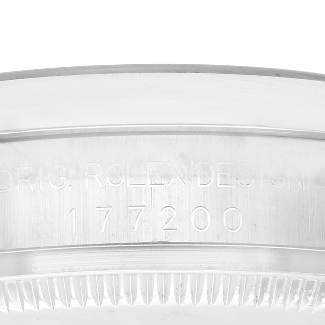 The image shows the side of a Rolex Mid-Size 177200 Women's Stainless Steel Silver Dial 177200 Women's Stainless Steel Silver Dial model case with engravings, including "ORIG. ROLEX DESIGN 177200."
