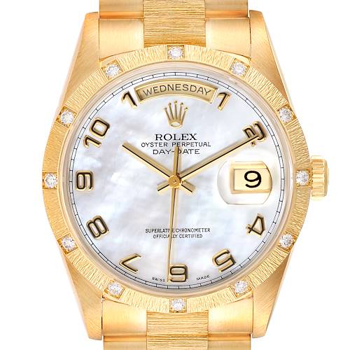 This image shows the face of a Rolex President 18308 Men's Yellow Gold Mother of Pearl Dial 18308 Men's Yellow Gold Mother of Pearl Dial model watch, featuring a gold bezel and bracelet, day and date display, with diamond hour markers.