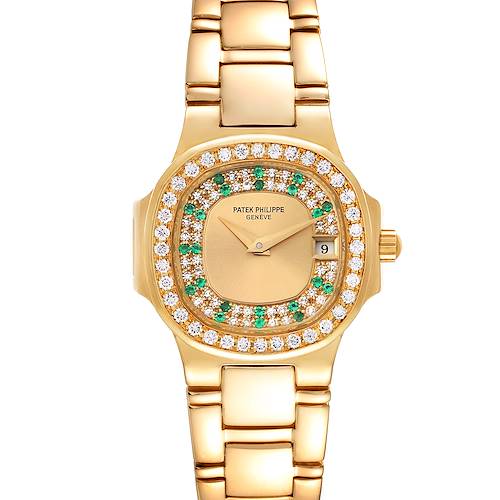 This image shows a Patek Philippe Nautilus 4700/153 Women's Yellow Gold Champagne Dial 4700/153 Women's Yellow Gold Champagne Dial watch from a top-down angle, featuring its dial, bezel with diamonds and emeralds, and bracelet.