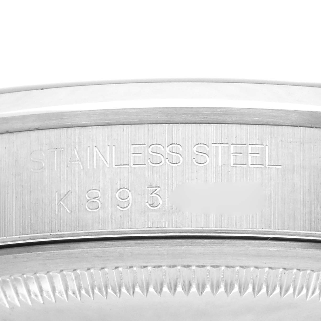 The image shows the side view of the bezel and case back of a Rolex Datejust 16200 Men's Stainless Steel Blue Dial 16200 Men's Stainless Steel Blue Dial, highlighting the stainless steel material.