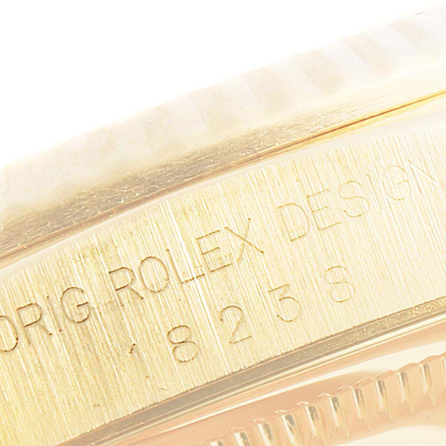 The image shows a close-up angle of the watch case side and bezel of the Rolex President 18238 Men's Yellow Gold Champagne Dial 18238 Men's Yellow Gold Champagne Dial model, featuring engraved text.