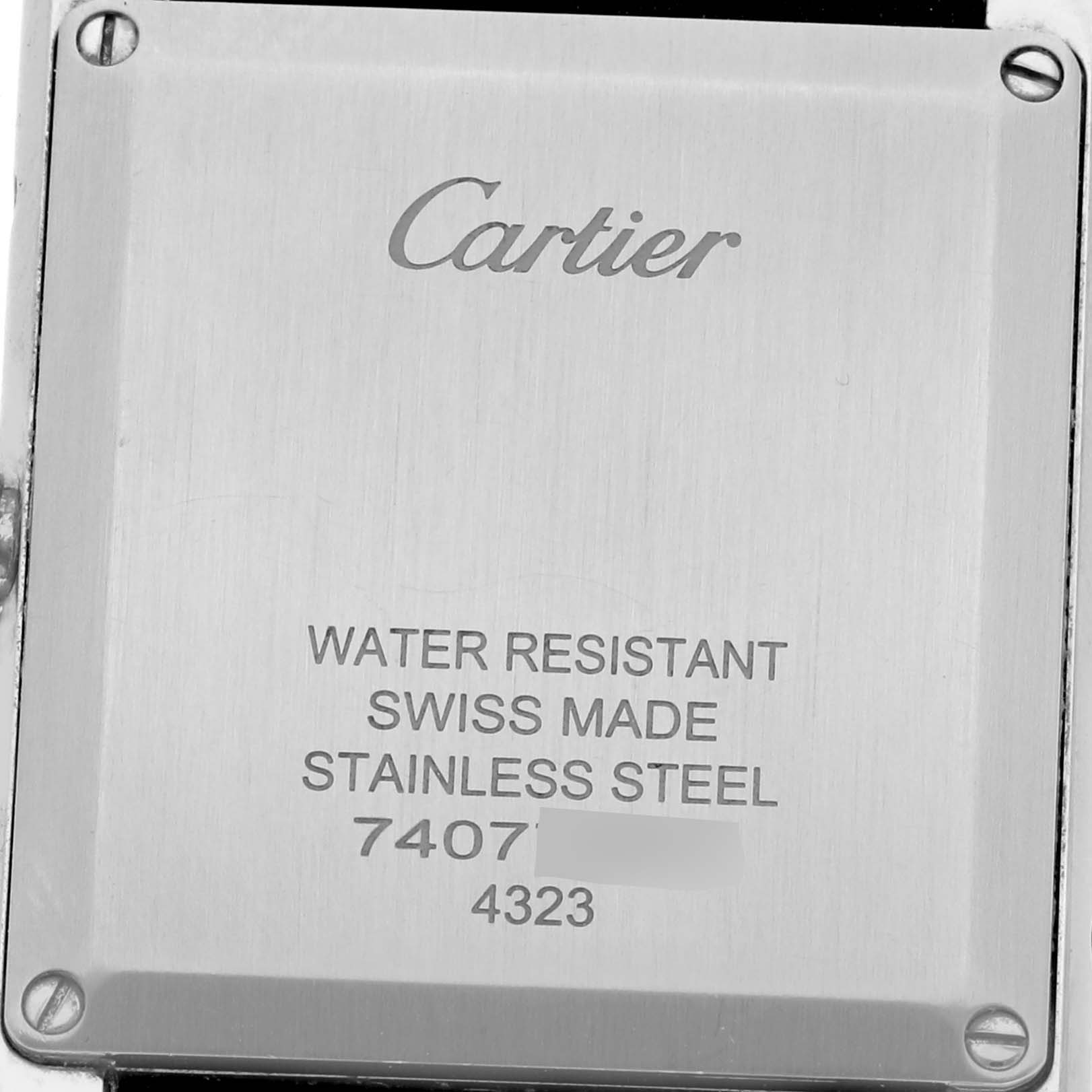 The image shows the back of a Cartier Tank Must W4TA0017 Women's Stainless Steel Silver Dial W4TA0017 Women's Stainless Steel Silver Dial watch, displaying brand and material information.