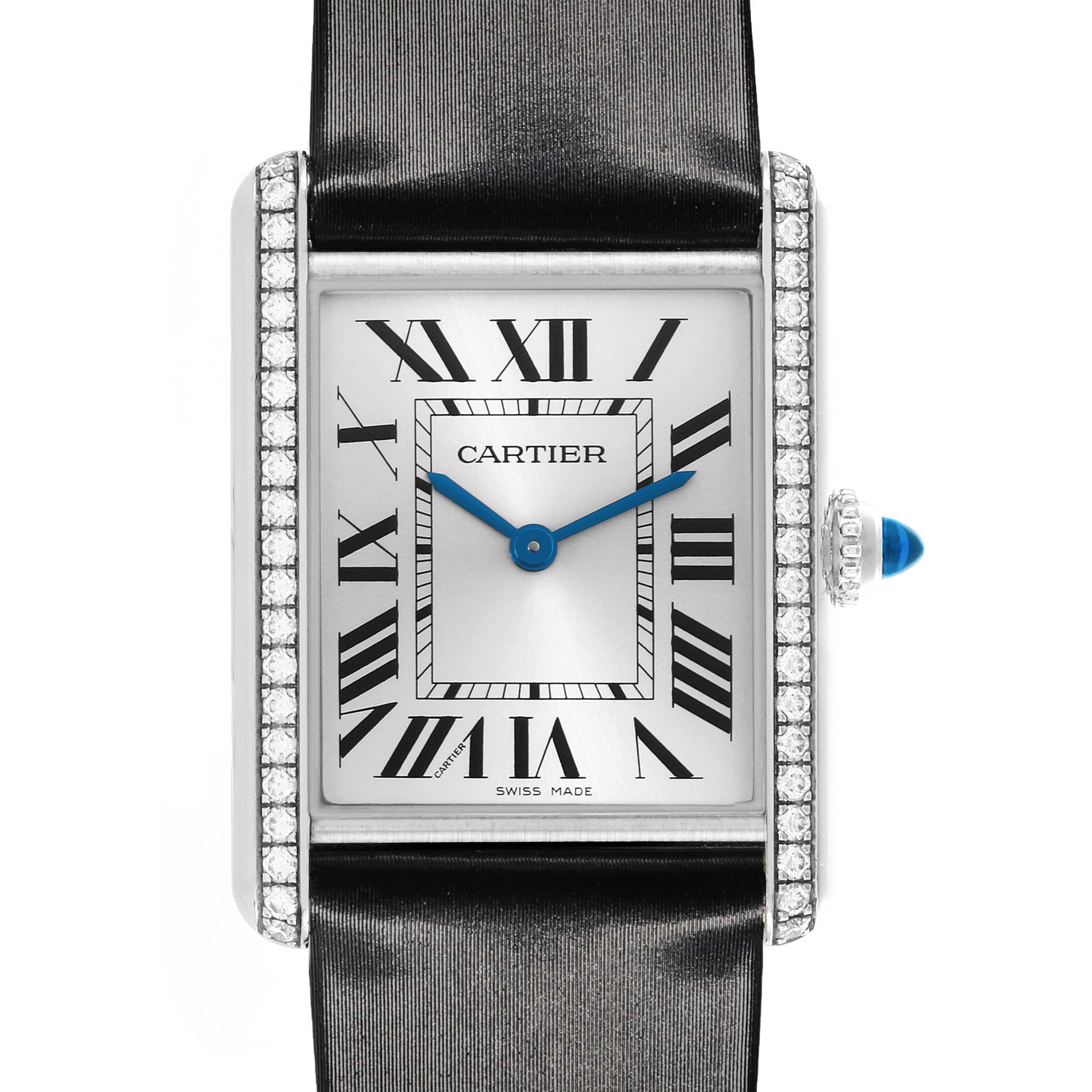 The Cartier Tank Must W4TA0017 Women's Stainless Steel Silver Dial W4TA0017 Women's Stainless Steel Silver Dial watch is shown from a front angle, highlighting the face, Roman numerals, and diamond-encrusted bezel.