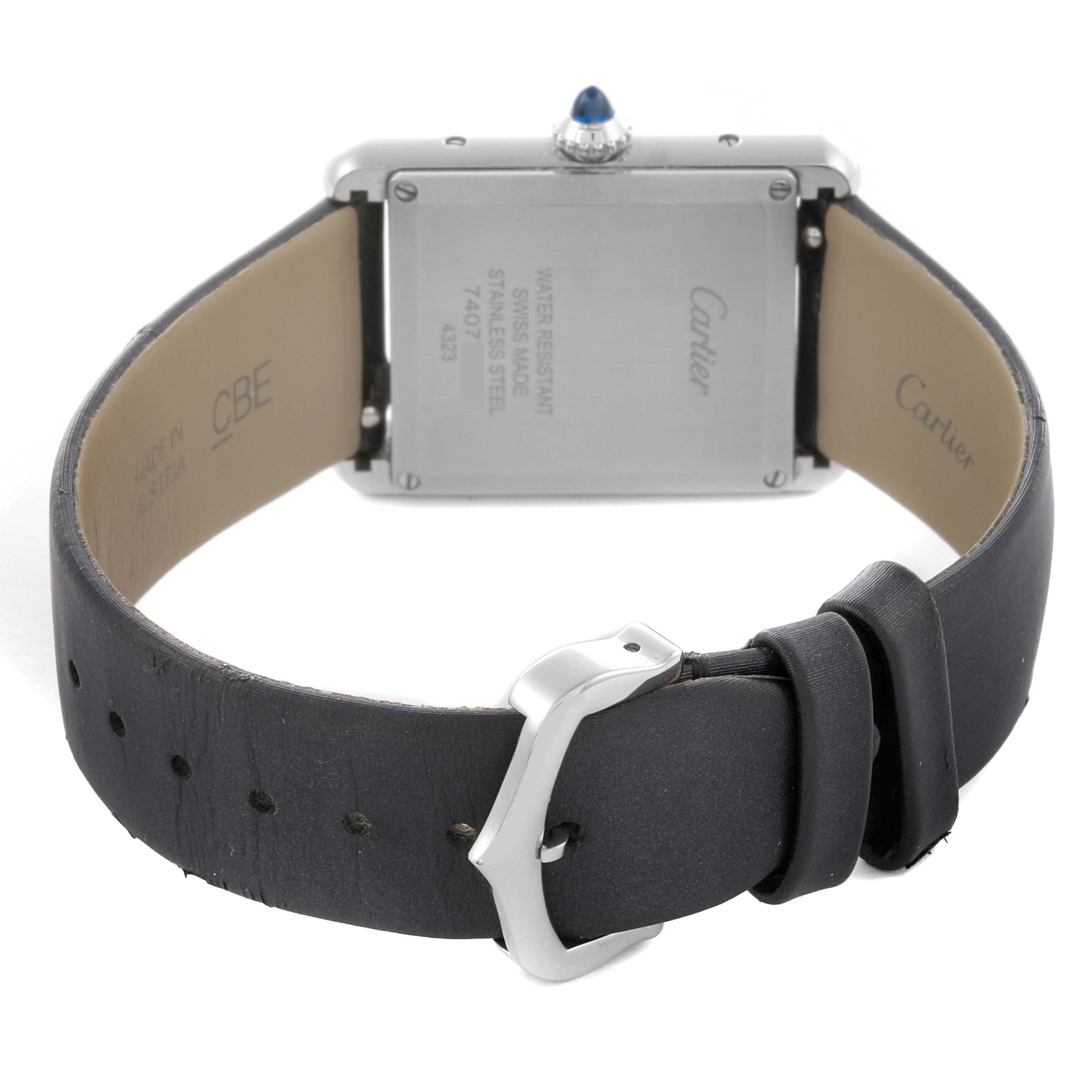 The Cartier Tank Must W4TA0017 Women's Stainless Steel Silver Dial W4TA0017 Women's Stainless Steel Silver Dial watch is shown from the back, displaying the case back, strap, and buckle.