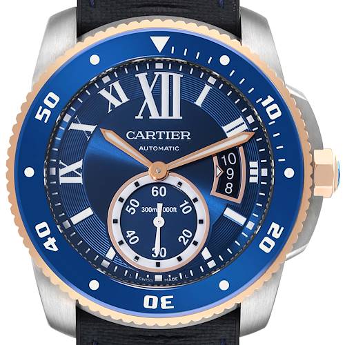 The image shows a front view of the Calibre de Cartier watch by Cartier, highlighting its blue dial, gold hands, and bezel detail.