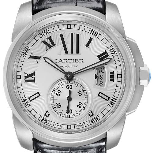 The Calibre de Cartier watch is shown from the front, highlighting the dial, Roman numerals, and date window.