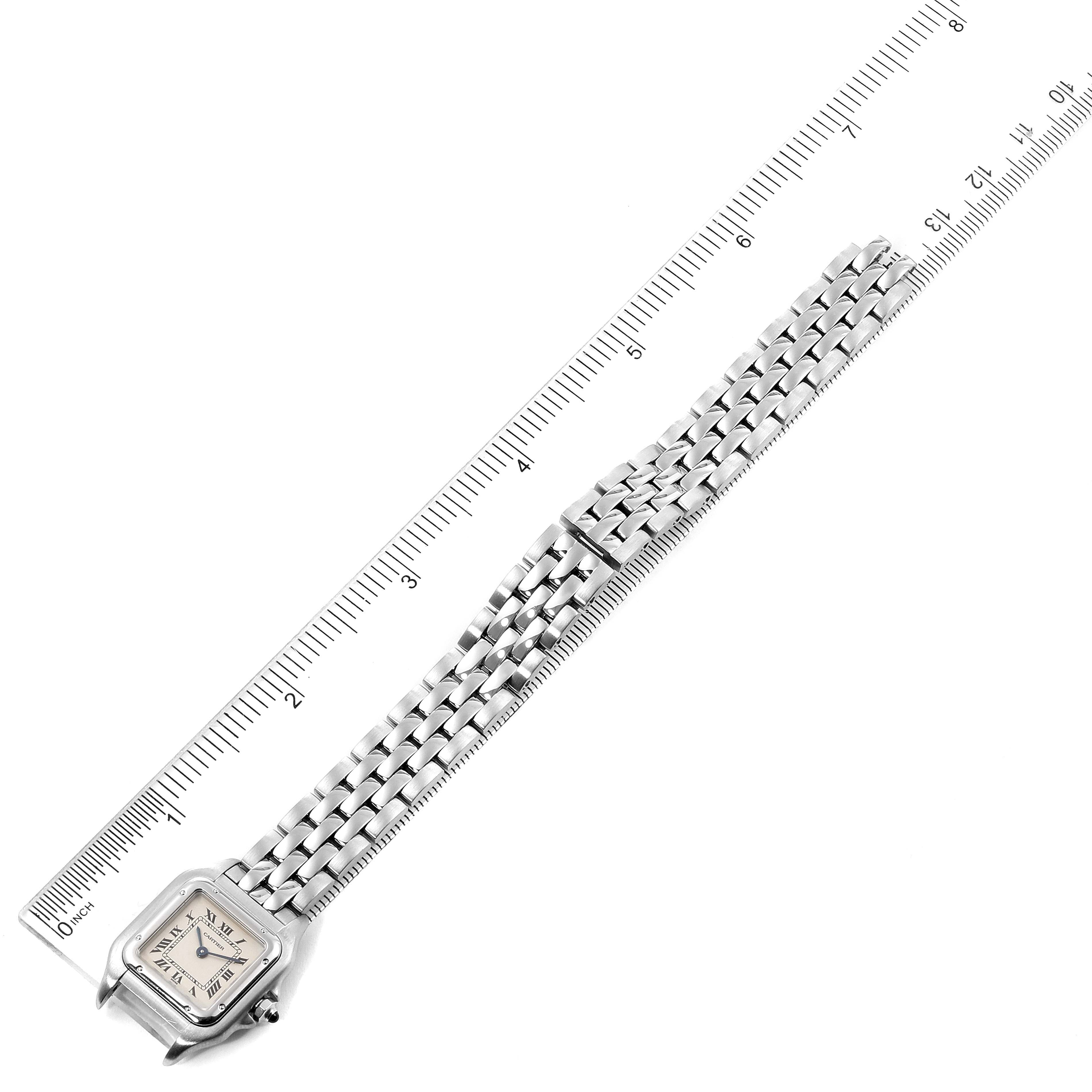 This image shows a top-down view of a Cartier Panthere W25033P5 Women's Stainless Steel Silver Dial W25033P5 Women's Stainless Steel Silver Dial watch with a silver bracelet, positioned next to a ruler for scale.