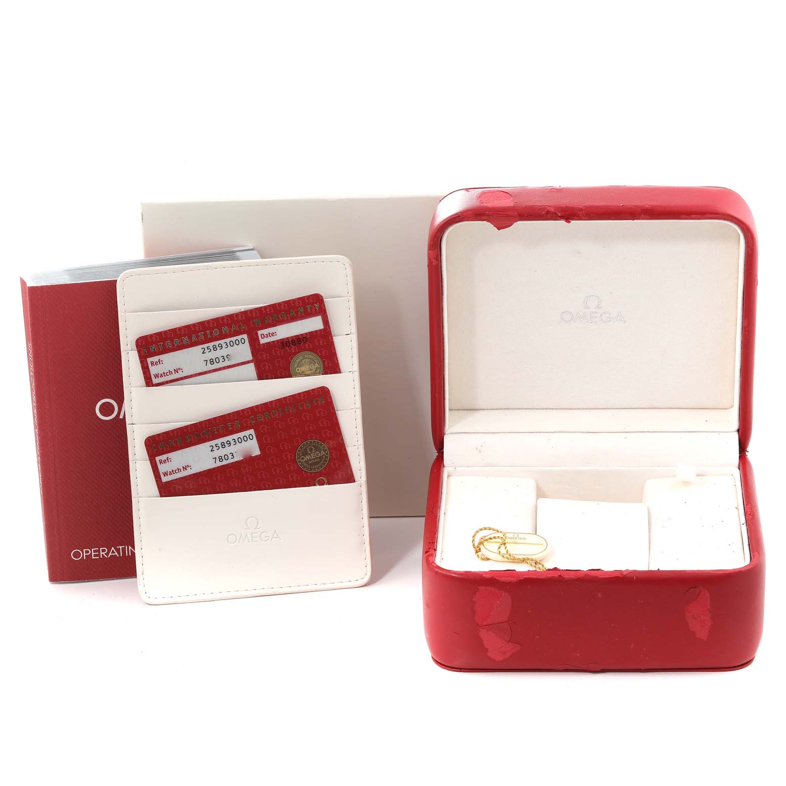 The image shows a red Omega Seamaster 2589.30.00 Men's Stainless Steel Silver Dial 2589.30.00 Men's Stainless Steel Silver Dial watch box, an instruction manual, and warranty cards in a white holder.