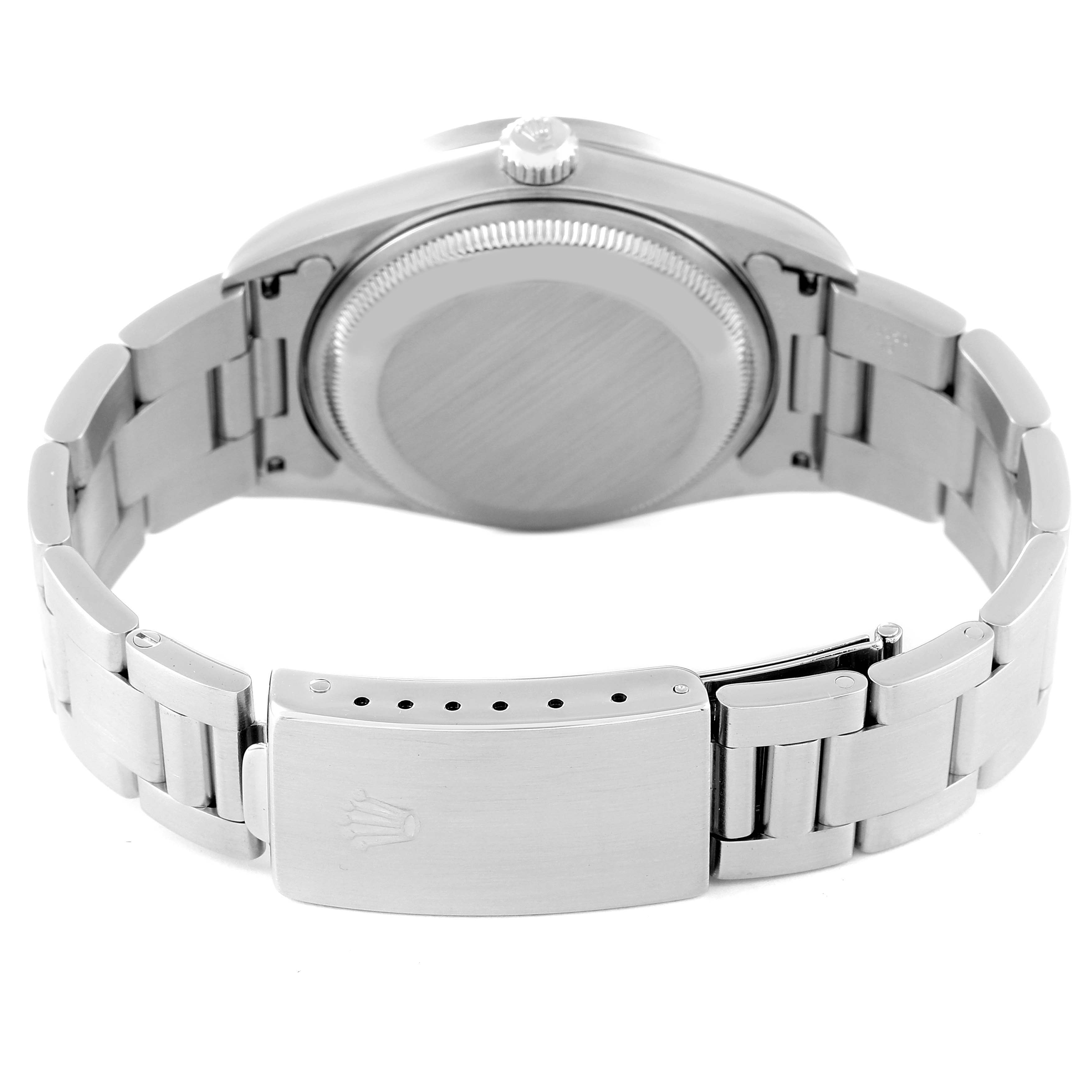 The image shows the back view of a Rolex Date 15210 Men's Stainless Steel Silver Dial 15210 Men's Stainless Steel Silver Dial watch, including the case back and the clasp of the metal bracelet.