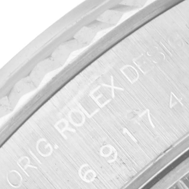 This is a close-up image showing the engraved caseback of a Rolex Datejust 69174 Women's Stainless Steel Blue Dial 69174 Women's Stainless Steel Blue Dial watch.