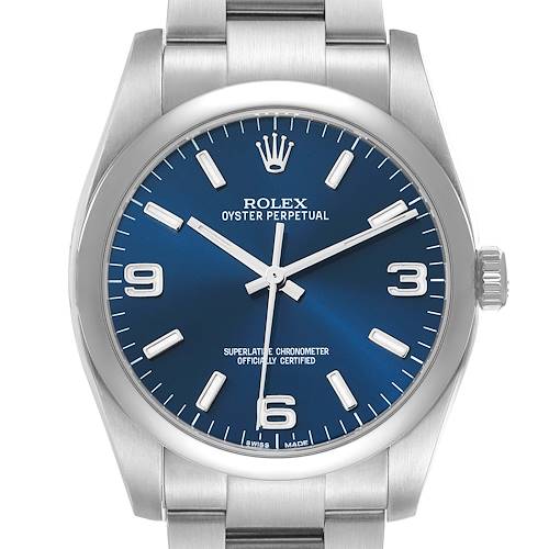 The Rolex Oyster Perpetual 116000 Men's Stainless Steel Blue Dial watch is shown from the front, displaying the blue dial, hands, crown, and part of the bracelet.
