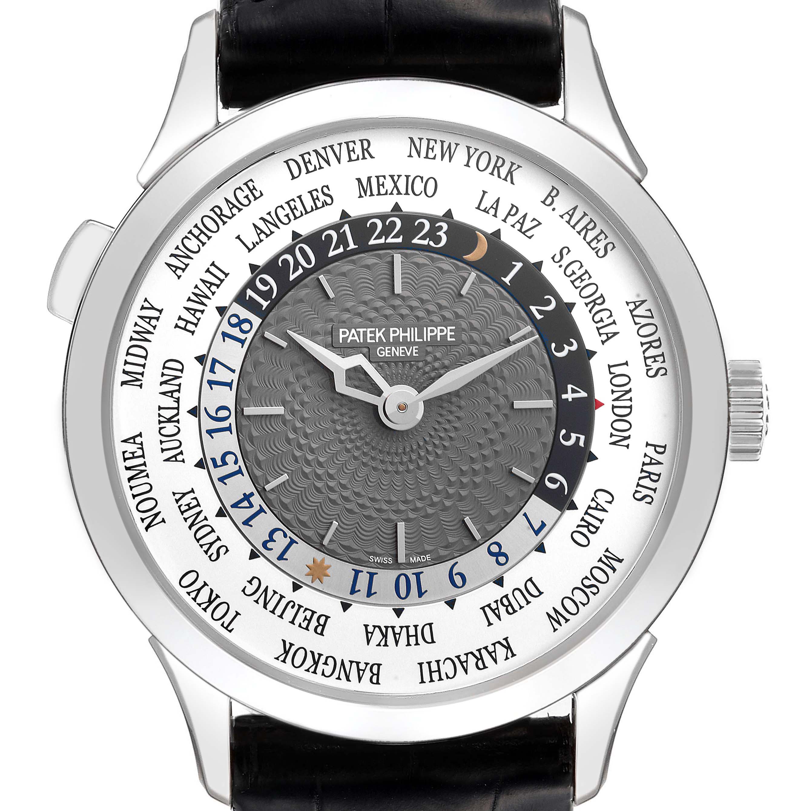 The image shows the face of a Patek Philippe Complications 5230G-001 Men's White Gold Grey Dial 5230G-001 Men's White Gold Grey Dial watch, featuring global time zones and a detailed dial.