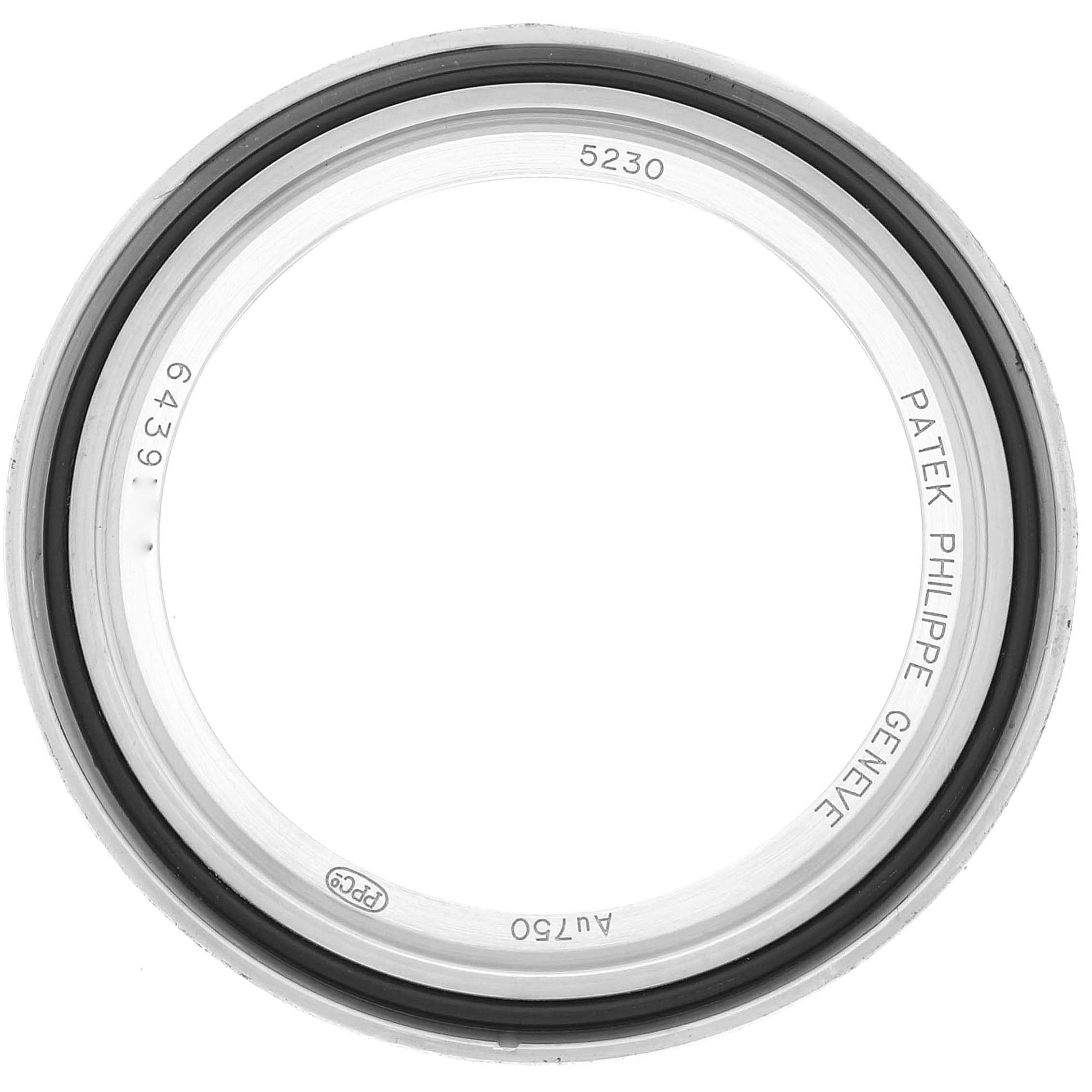 This image shows a close-up view of the bezel for the Patek Philippe Complications 5230G-001 Men's White Gold Grey Dial 5230G-001 Men's White Gold Grey Dial model 5230 watch.