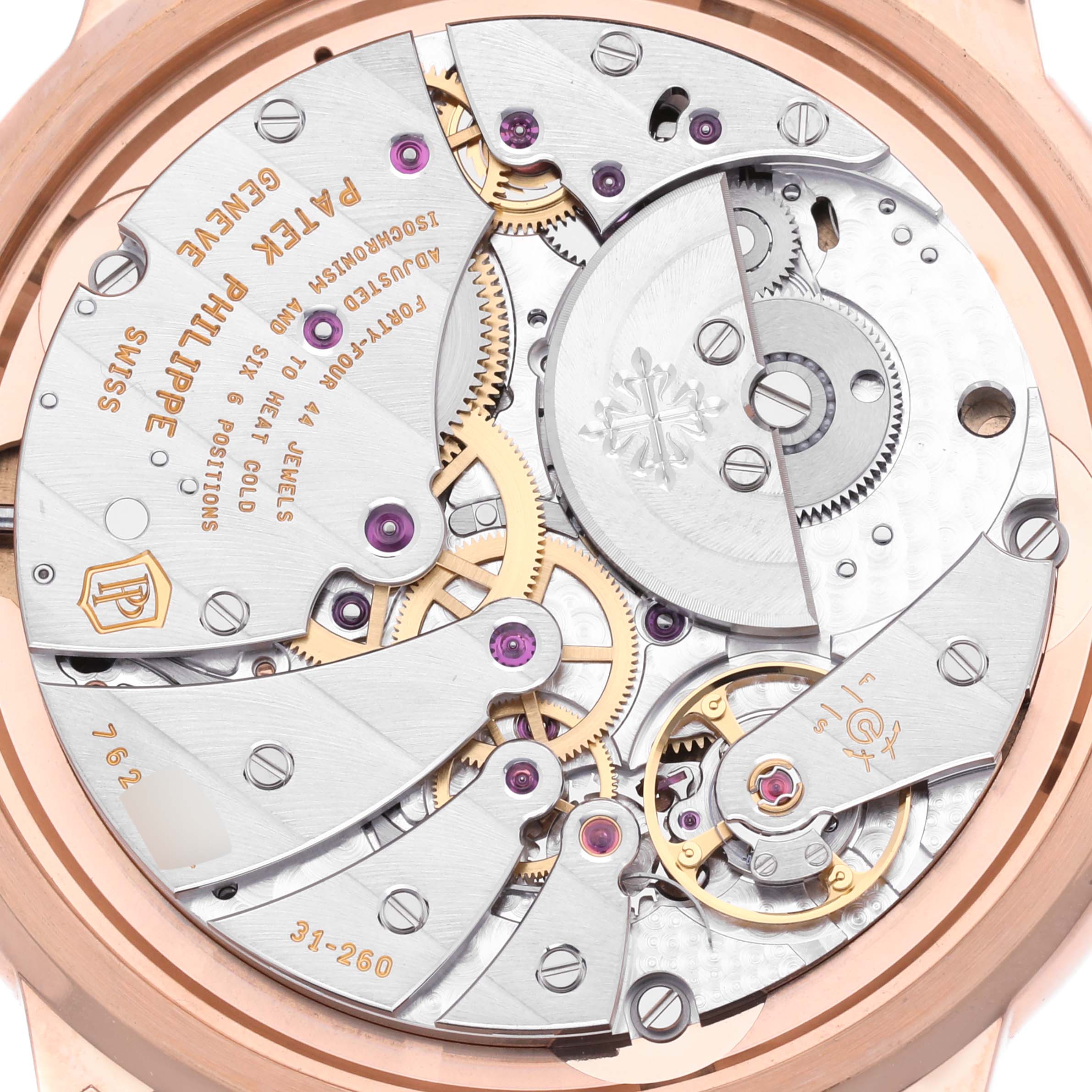 The image shows the movement of the Patek Philippe Calatrava 5224R-001 Men's Rose Gold Blue Dial 5224R-001 Men's Rose Gold Blue Dial model from a backside angle, highlighting gears and jewels.