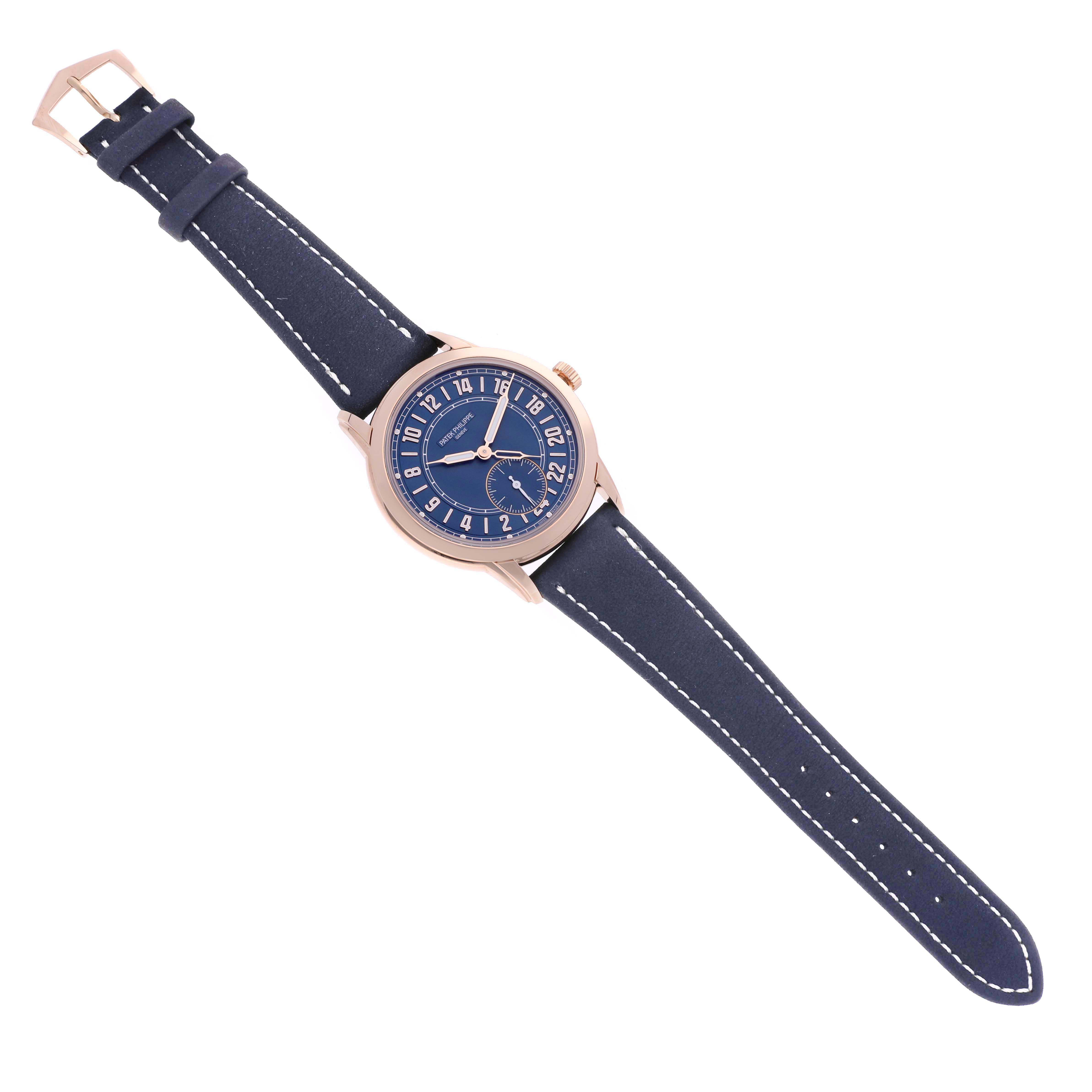 The Patek Philippe Calatrava 5224R-001 Men's Rose Gold Blue Dial 5224R-001 Men's Rose Gold Blue Dial watch is shown from a top-down angle, displaying the face, case, and full leather strap.