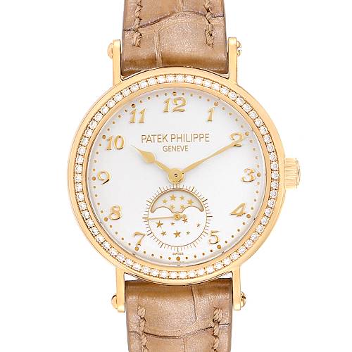 This is a front view of the Patek Philippe Calatrava 7121J-001 Women's Yellow Gold Silver Dial 7121J-001 Women's Yellow Gold Silver Dial watch, showing its brown leather strap, gold case, and diamond bezel.