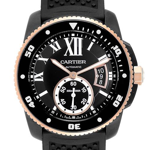 The image shows a front view of the Calibre de Cartier model by Cartier, focusing on the watch face and bezel.