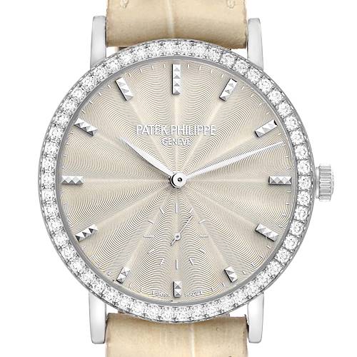 The Patek Philippe Calatrava 7120 Women's White Gold Beige Dial watch is shown from the front, highlighting the face with diamond bezel and guilloché pattern.