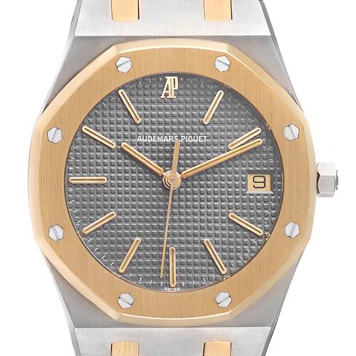 The image shows a frontal view of the Audemars Piguet Royal Oak 6023SA Men's Steel and Gold (two tone) Grey Dial 6023SA Men's Steel and Gold (two tone) Grey Dial watch, highlighting its octagonal bezel, dial, and hands.