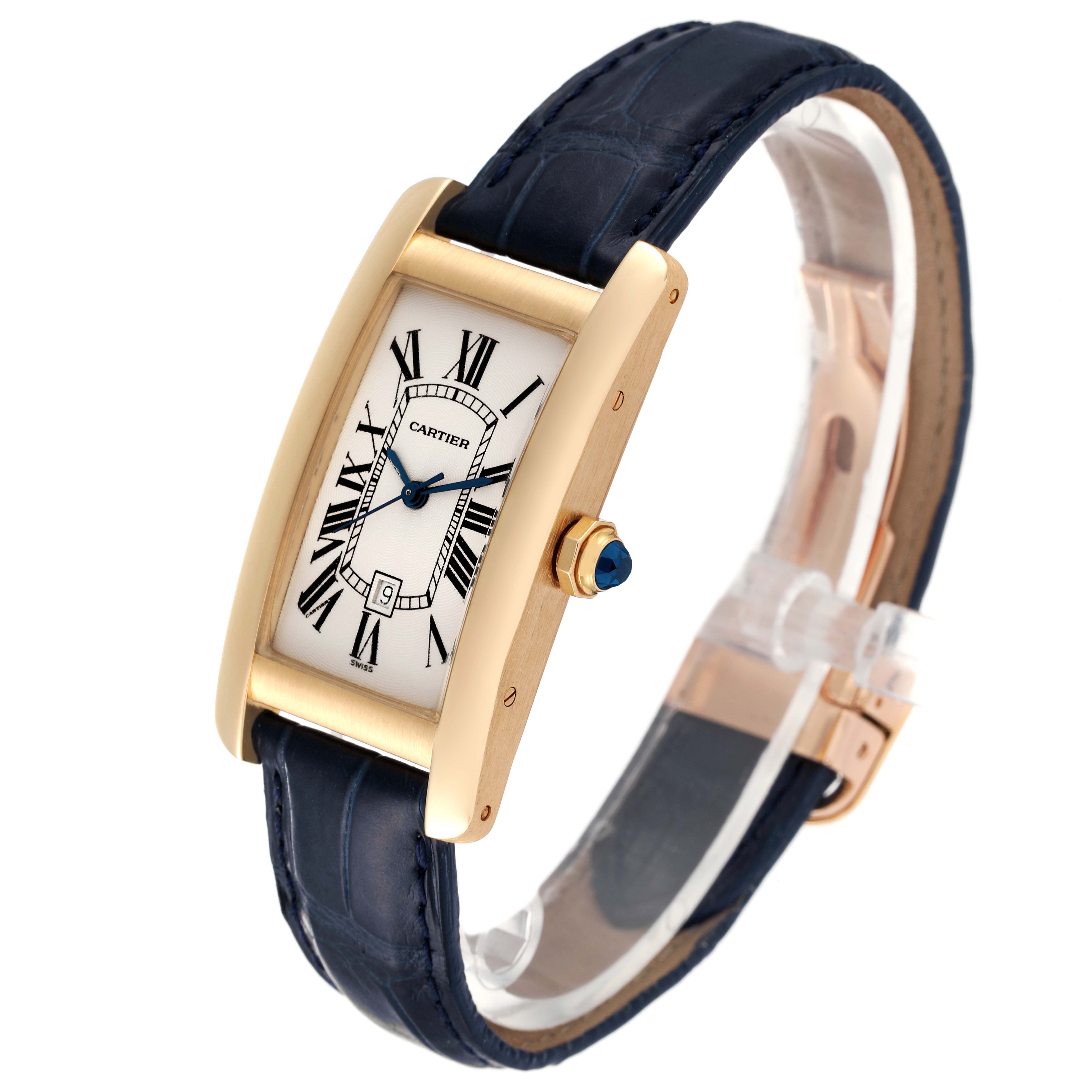 The image shows an oblique view of the Cartier Tank Americaine W2603556 Men's Yellow Gold Silver Dial W2603556 Men's Yellow Gold Silver Dial watch, highlighting its face, bezel, crown, and strap.