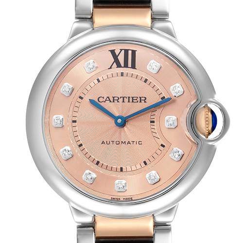 The Cartier Ballon Bleu WE902054 Women's Steel and Gold (two tone) Pink Dial watch is shown from the front, highlighting its face, crown, and part of the strap.