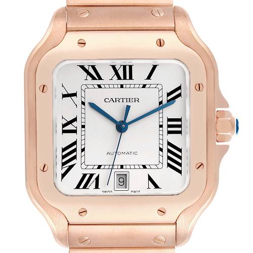 The image shows a Cartier Santos WGSA0018 Men's Rose Gold Silver Dial watch face front-on, highlighting its square dial, blue hands, and date display.