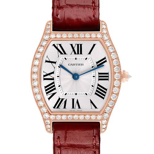 The Cartier Tortue WA501008 Women's Rose Gold Silver Dial watch is shown from a direct front angle, featuring its diamond-studded bezel and red leather strap.