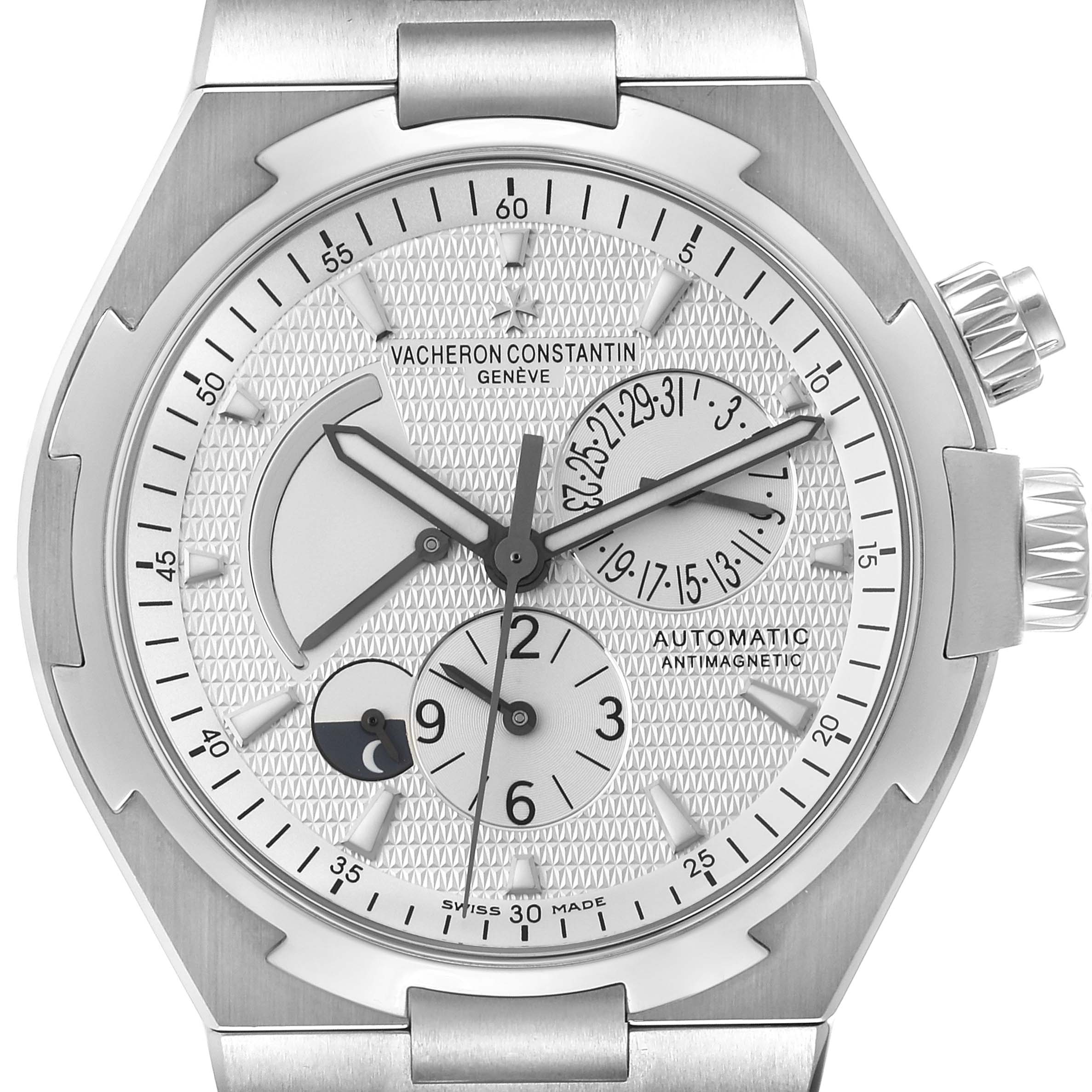 The image displays the face of the Vacheron Constantin Overseas 47450/B01A-9226 Men's Stainless Steel Silver Dial 47450/B01A-9226 Men's Stainless Steel Silver Dial model, showcasing its dial, hands, subdials, and crown at a straight-on angle.