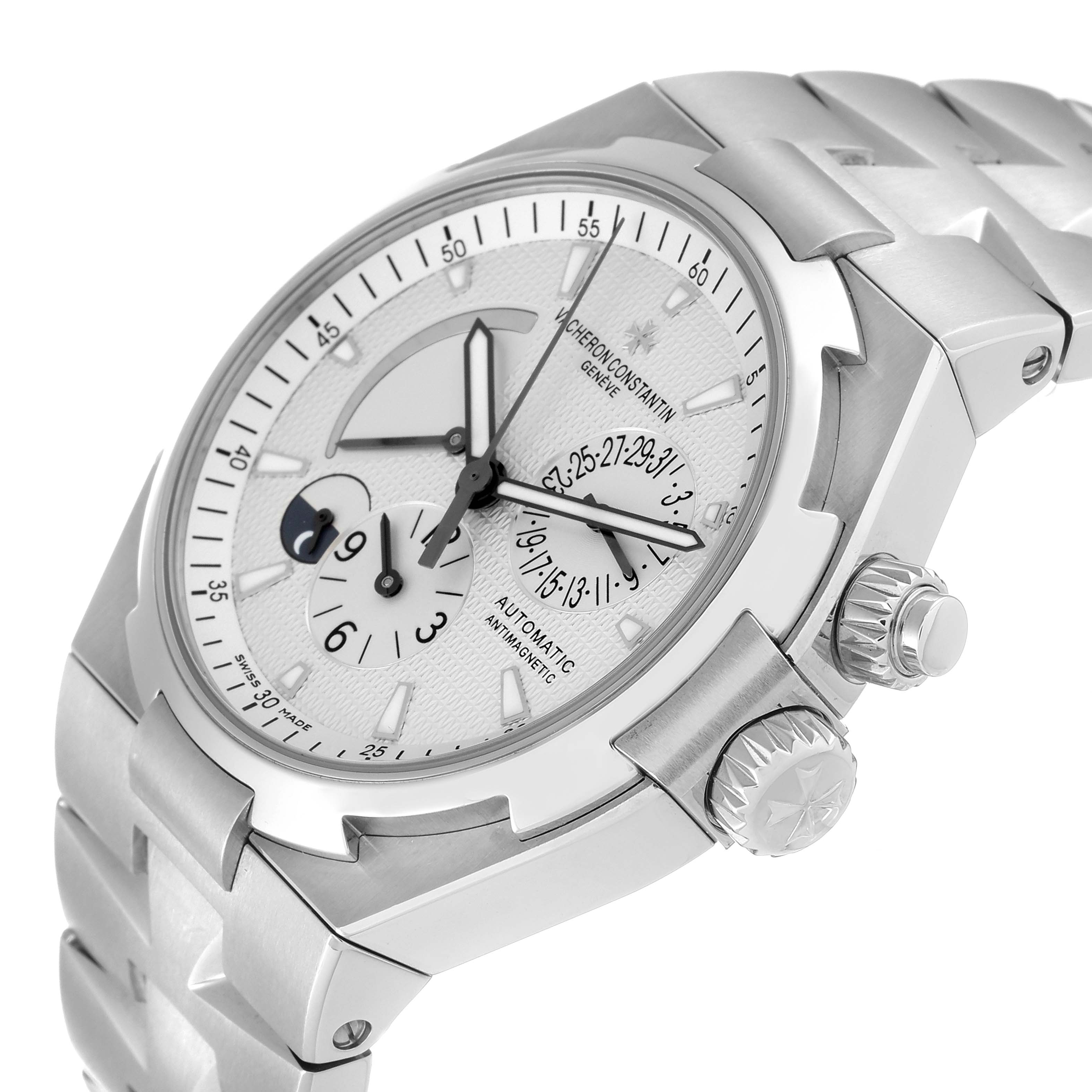The image shows a side view of the Vacheron Constantin Overseas 47450/B01A-9226 Men's Stainless Steel Silver Dial 47450/B01A-9226 Men's Stainless Steel Silver Dial watch, highlighting its dial, bezel, crown, and band.