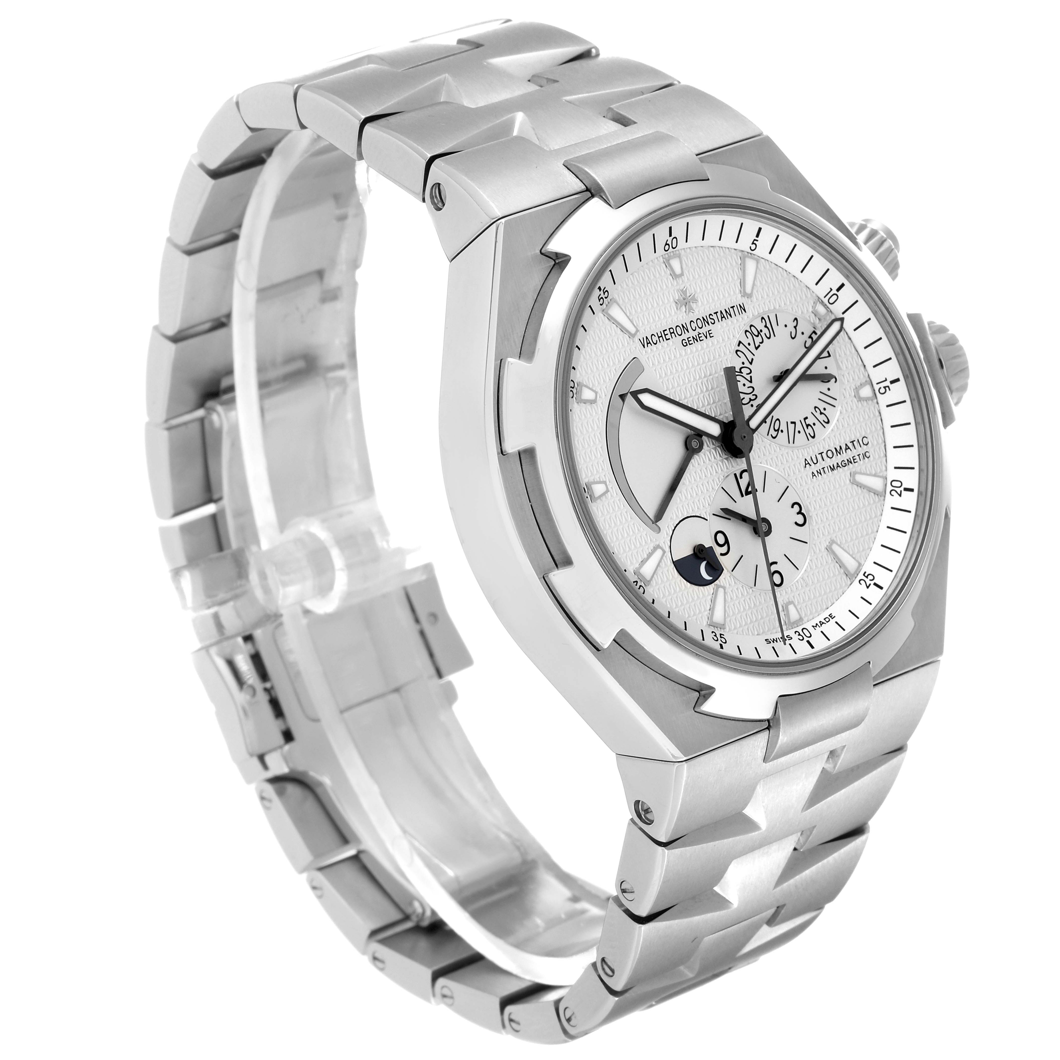 The image shows a side angle of a Vacheron Constantin Overseas 47450/B01A-9226 Men's Stainless Steel Silver Dial 47450/B01A-9226 Men's Stainless Steel Silver Dial watch, highlighting the face, bezel, bracelet, and crown.