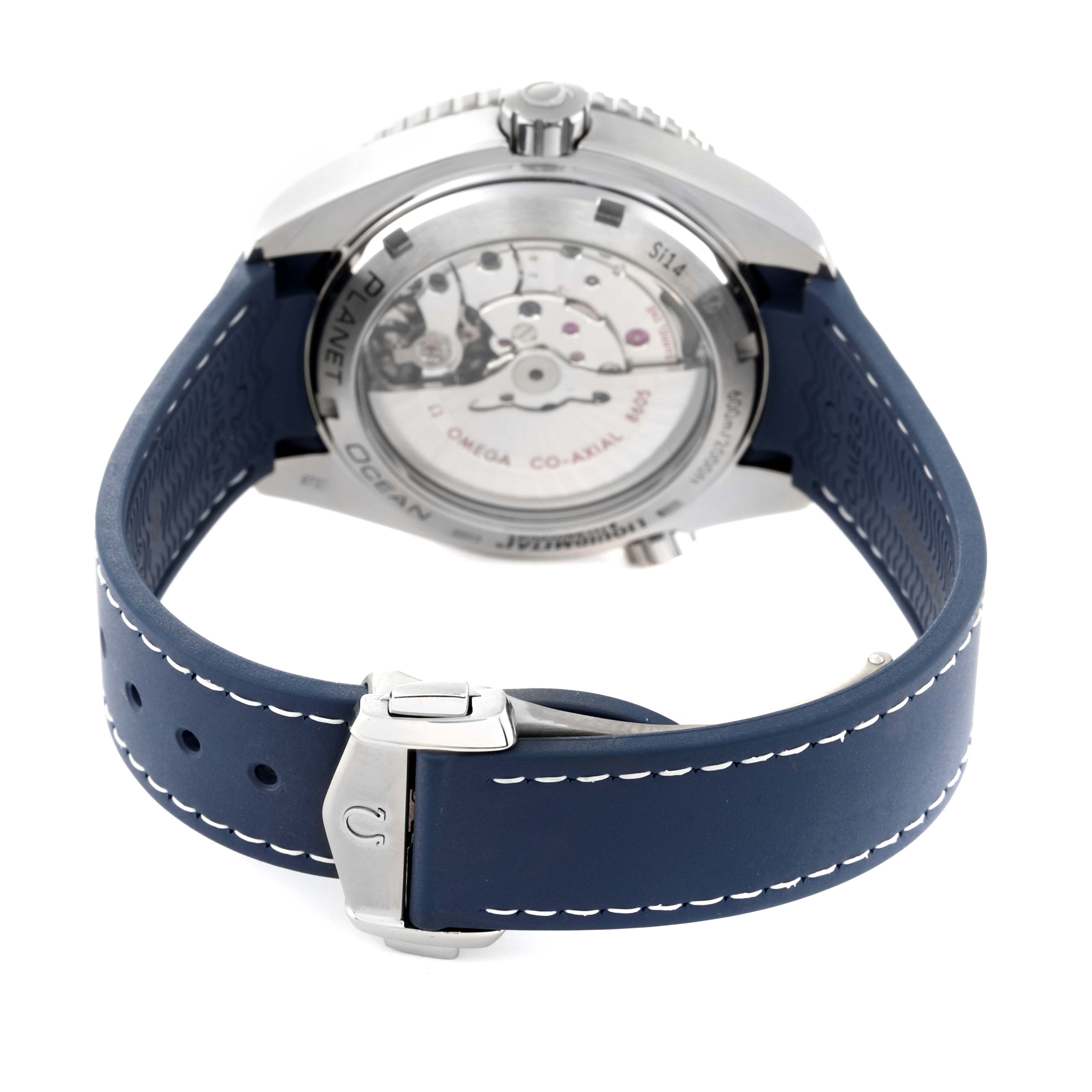 The image shows the back and side view of an Omega Planet Ocean 232.92.44.22.03.001 Men's Titanium Blue Dial 232.92.44.22.03.001 Men's Titanium Blue Dial model watch with a visible movement and blue strap.