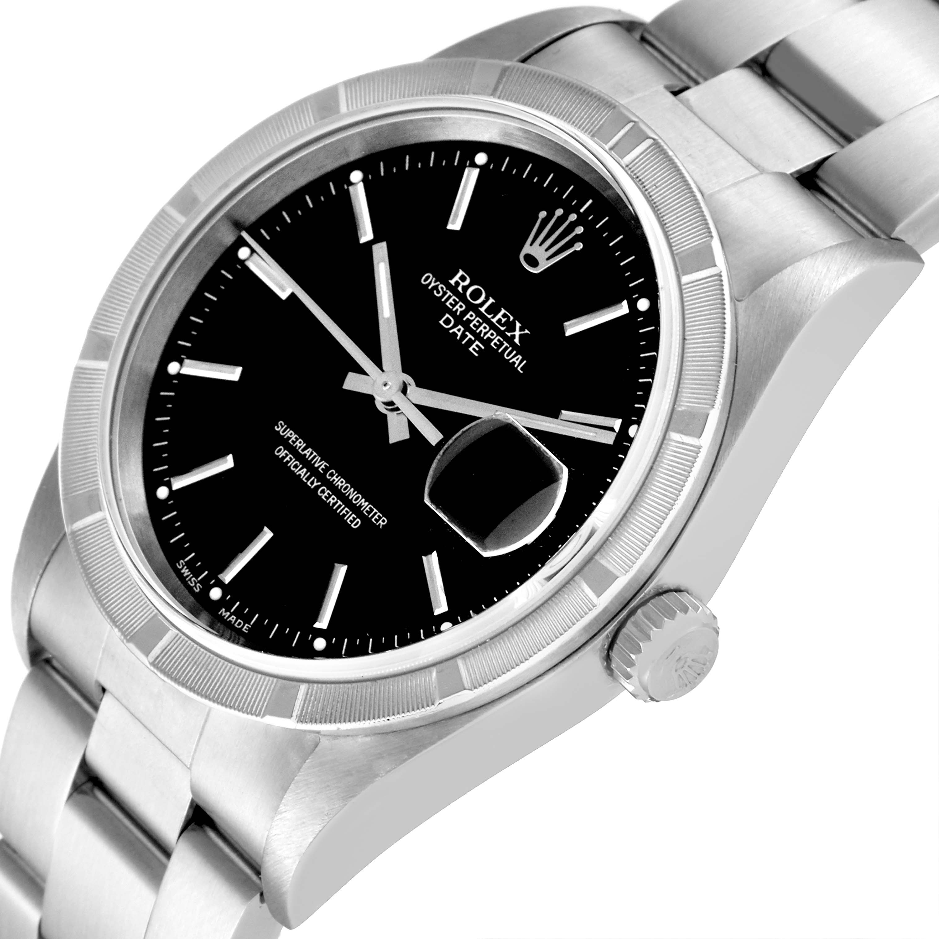 The image shows a close-up of the Rolex Oyster Perpetual Date watch, highlighting its black dial, hands, bezel, and part of the bracelet from a side angle.